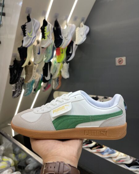 PUMA Palermo sneakers in a white and green colorway.