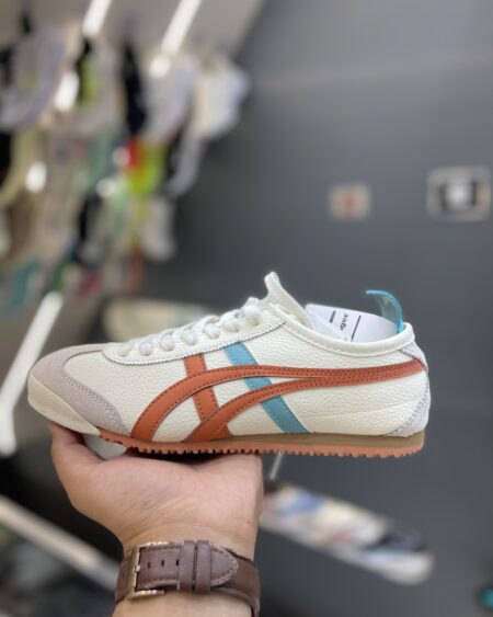 Onitsuka Tiger Mexico 66 sneakers in the "Cream/Piquant Orange" colorway.